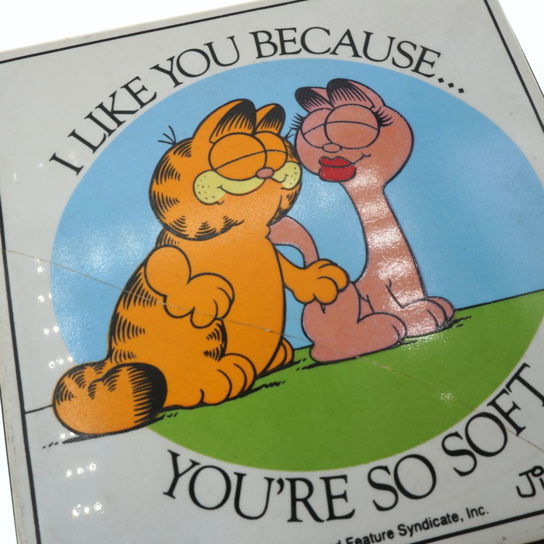 Crack across the front of a vintage Garfield tile designed by Jim Davis