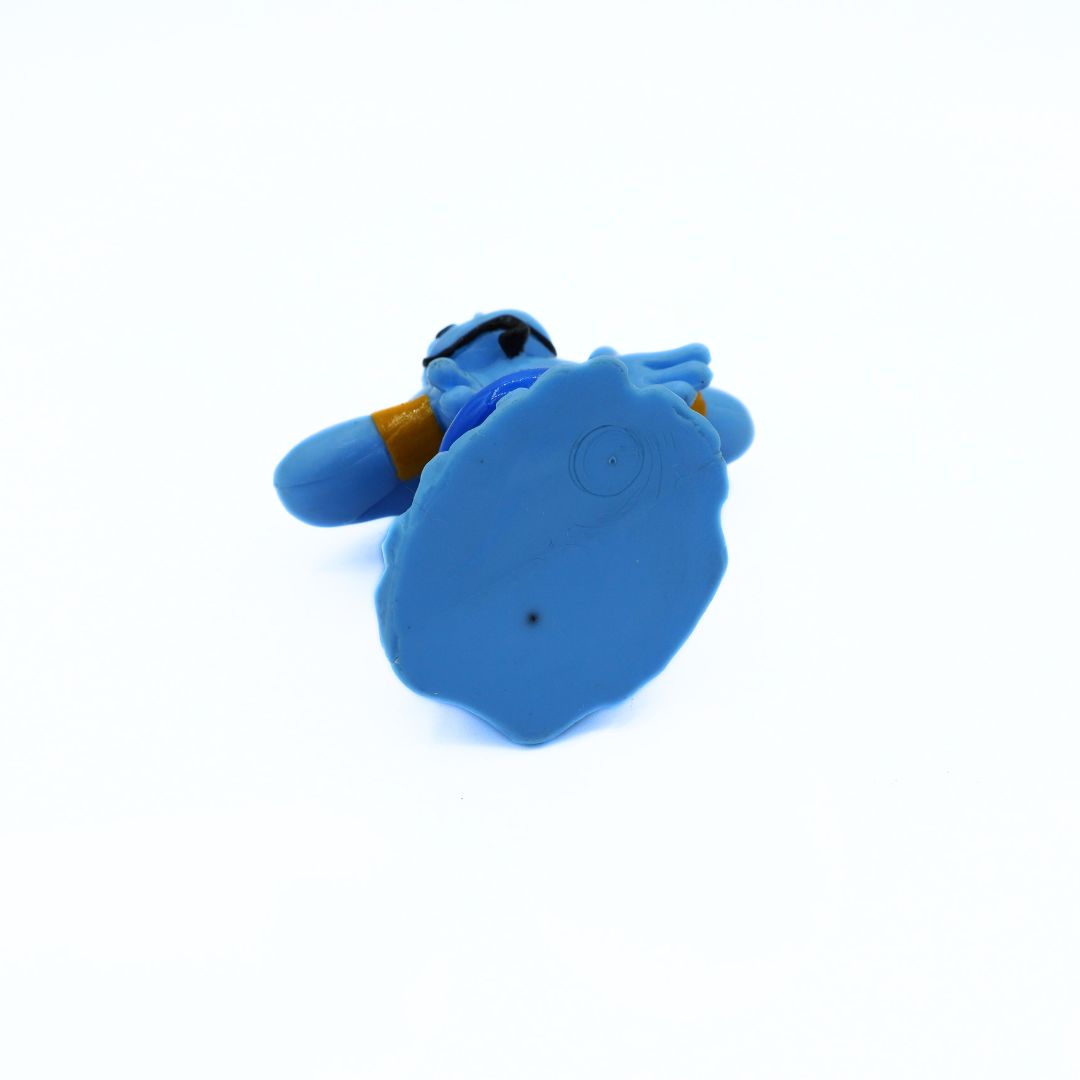 Underside of a vintage 2004 Genie toy from the movie Aladdin