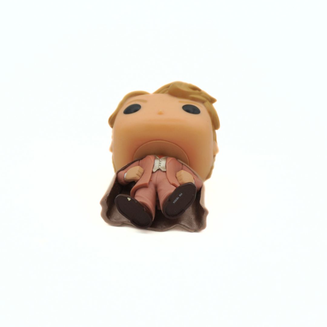 Small figurine of a character with a white background