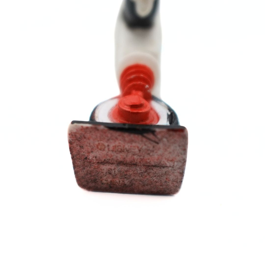 Underside of a vintage Gizmoduck figurine showing the imprint Disney branding