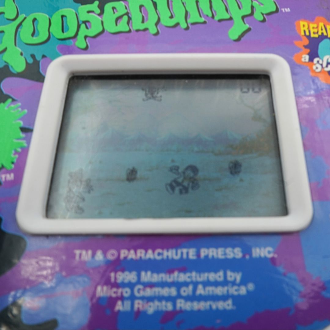 Vintage electronic game with 'Goosebumps' branding on a colorful background
