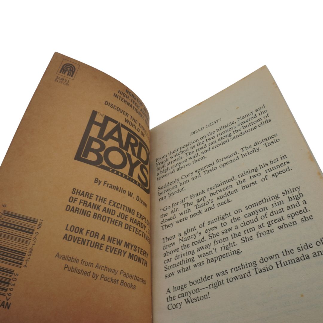Open book with 'Hard Boys' series cover and text on a white background