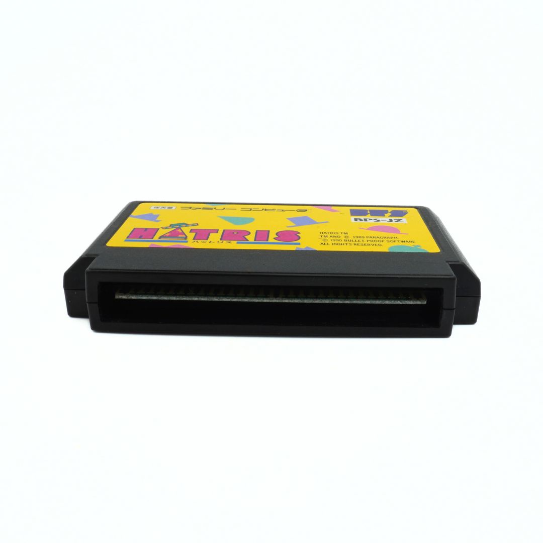 Underside of a vintage 1990 Famicom Hatris game with a yellow label