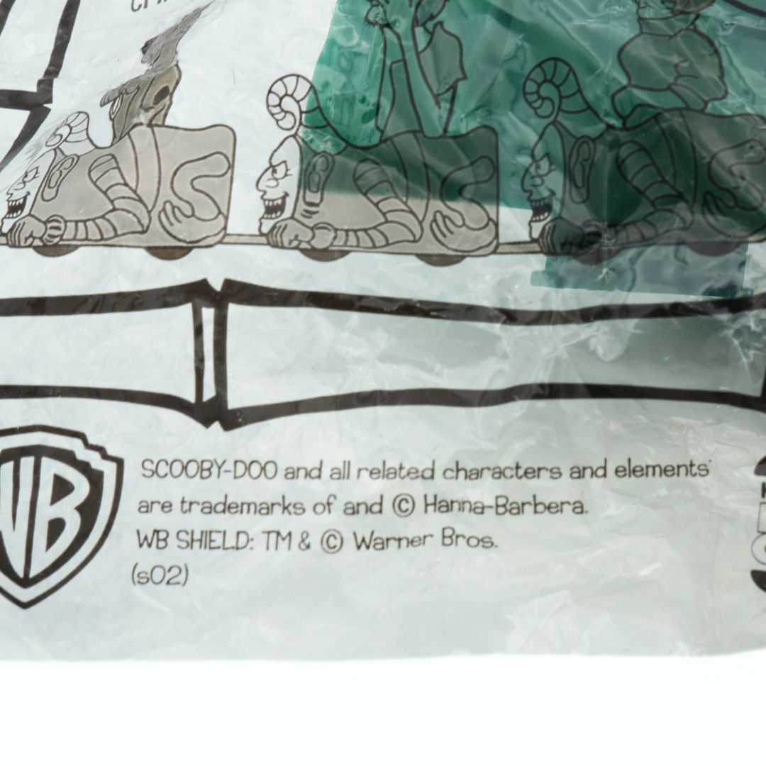 Branding on a vintage 2002 Velma Scooby Doo toy released as part of a Kids Club meal