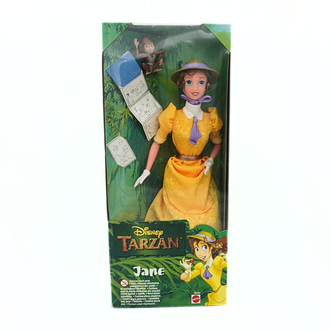 A 90s Jane doll from the Disney movie Tarzan, wearing a yellow dress with purple detailing