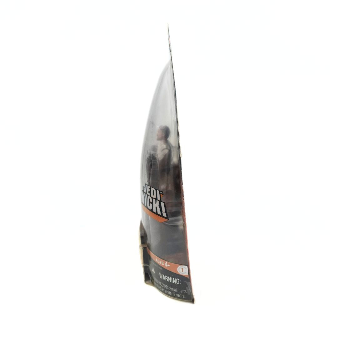 Side on angle of the 2005 Obi-Wan Kenobi Revenge of the Sith figurine seen through its packaging