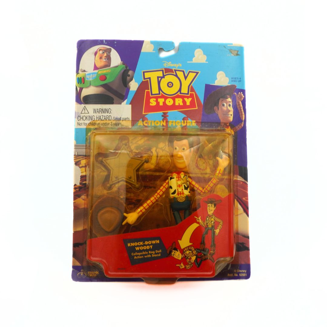 A 1995 Knock Down Woody collapsible rag doll with stand toy
