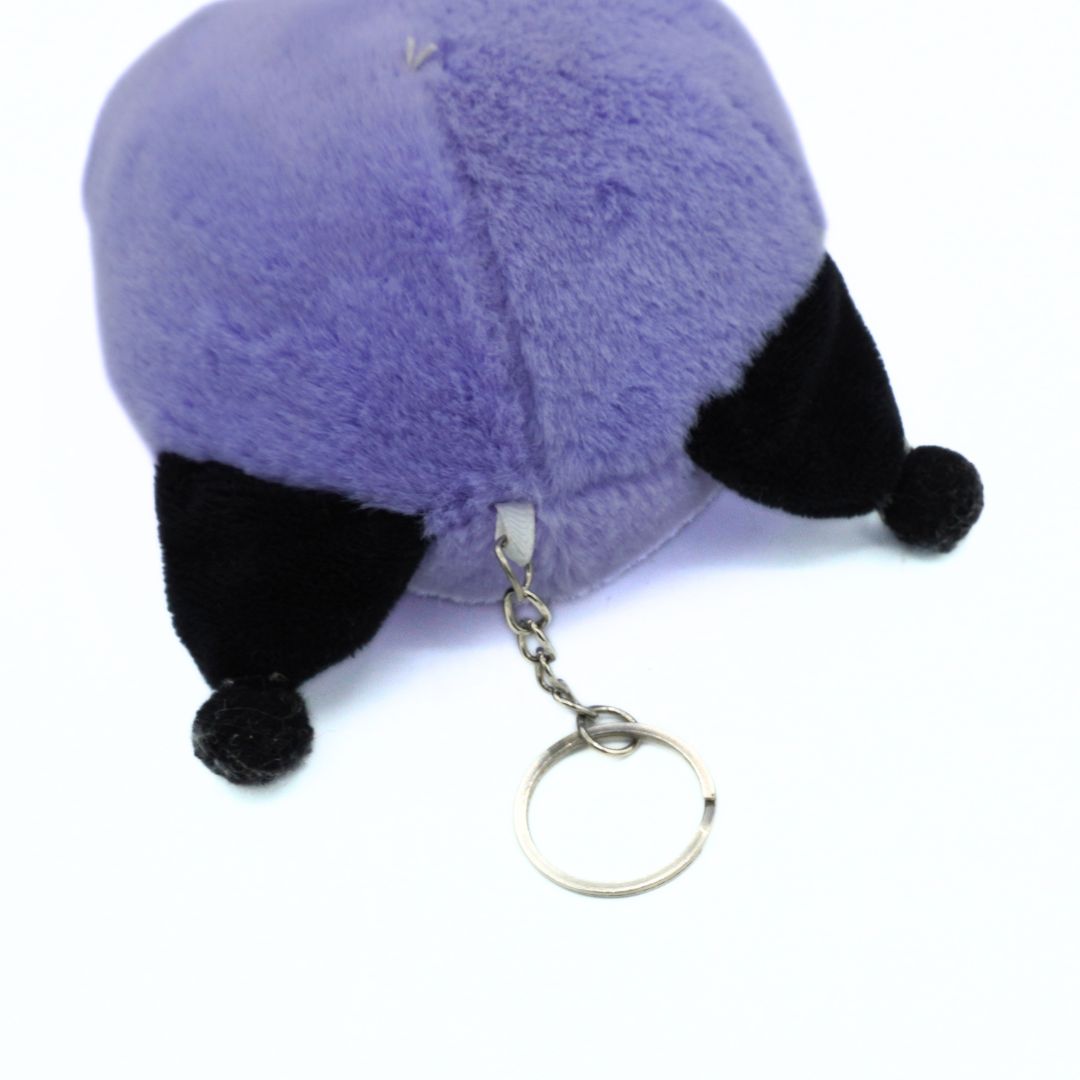 A purple plush fox keychain with black ears and a silver metal key ring, shown on a plain white background.