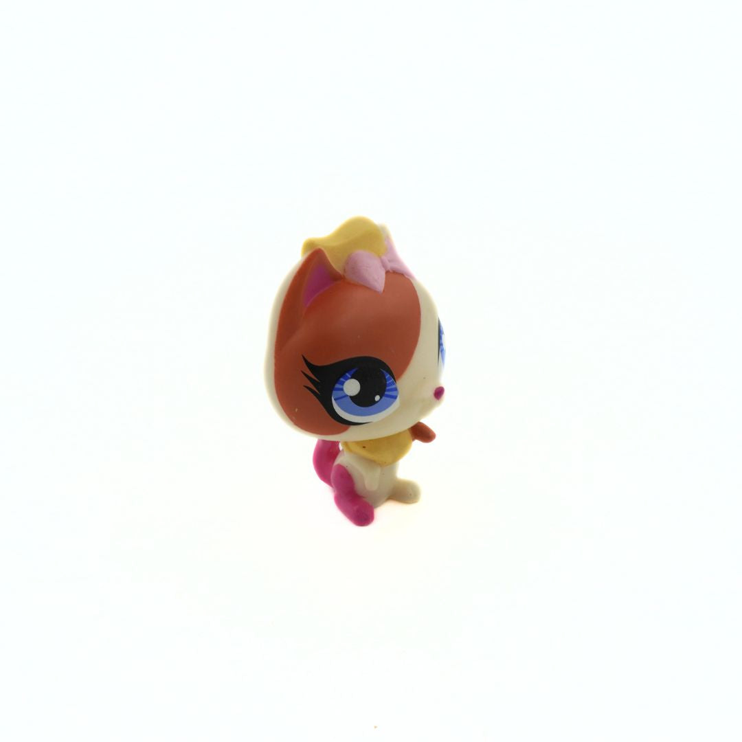 Orange and beige kitten with a pink tail released by Littlest Pet Shop