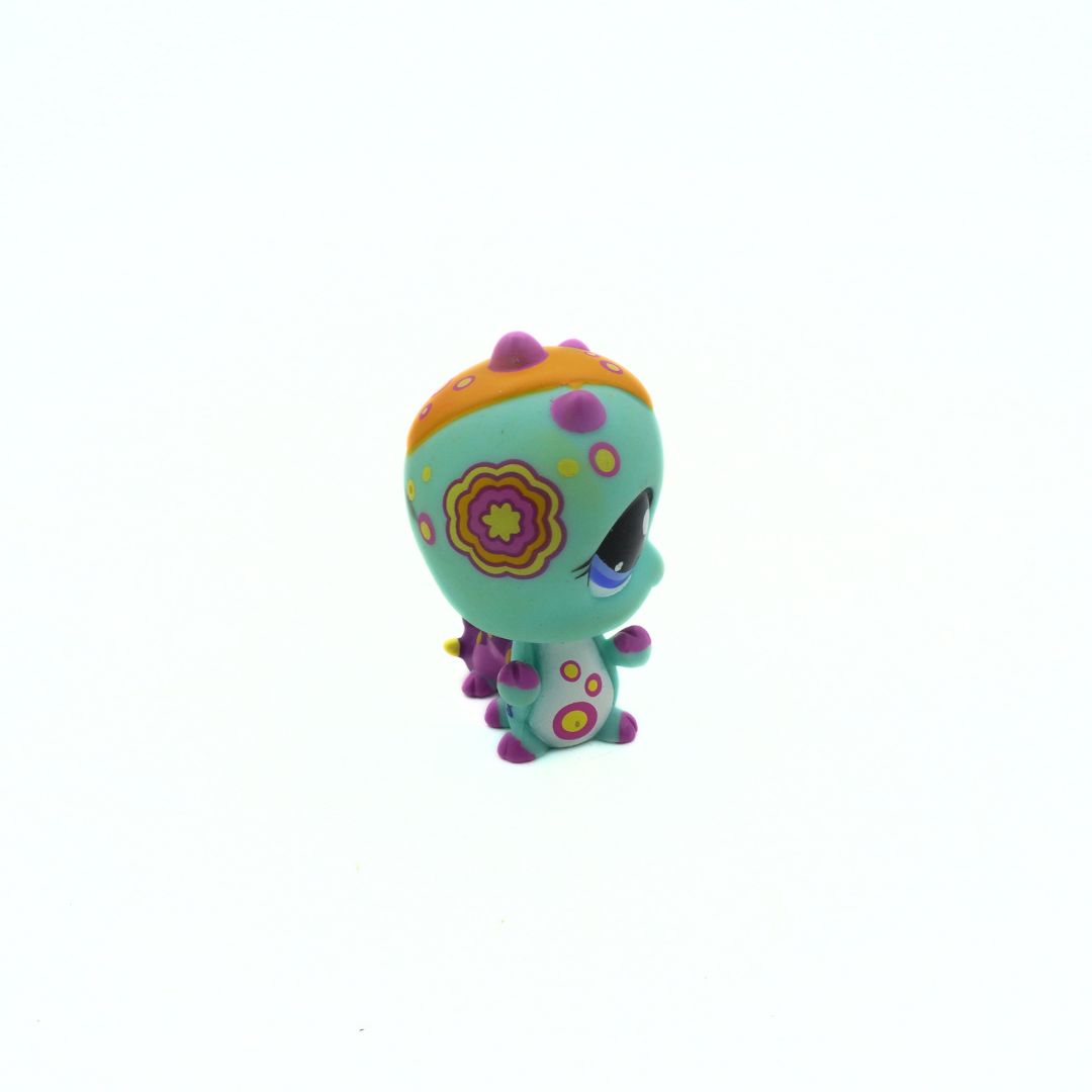 Colorful toy figure with a floral design on a white background
