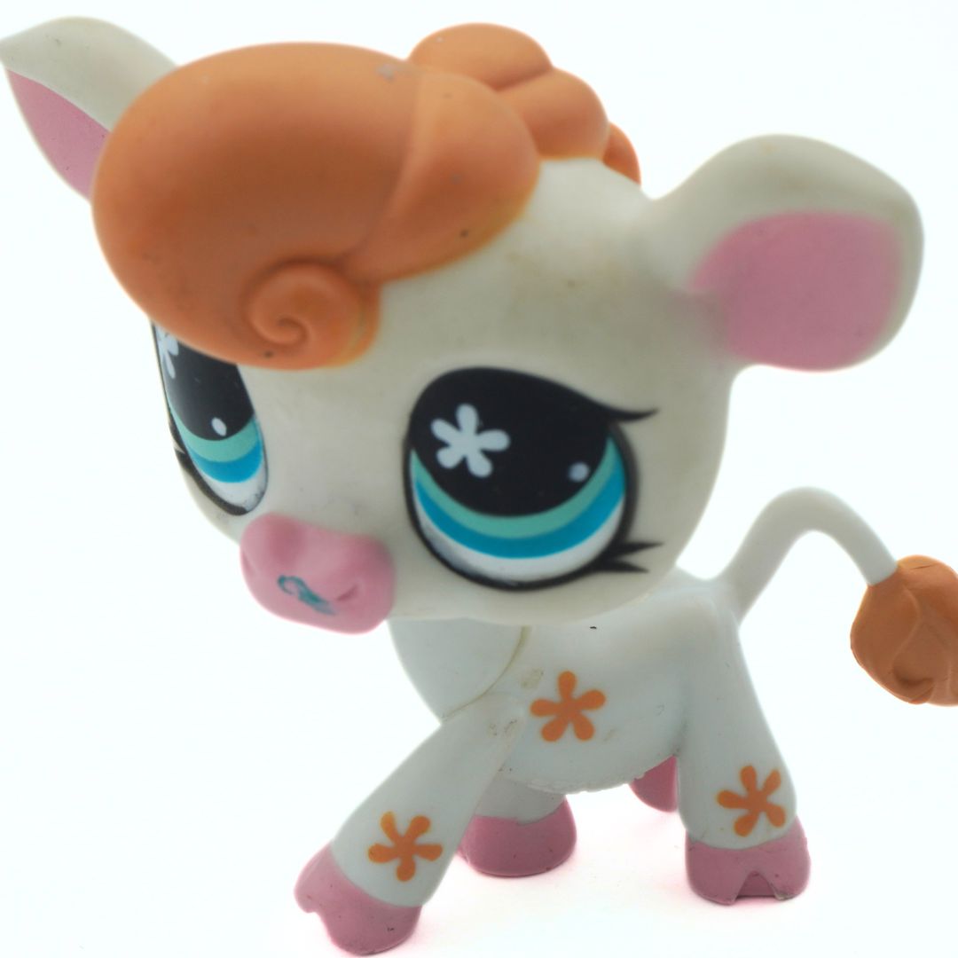 Toy figure with orange hair and blue eyes on a white background