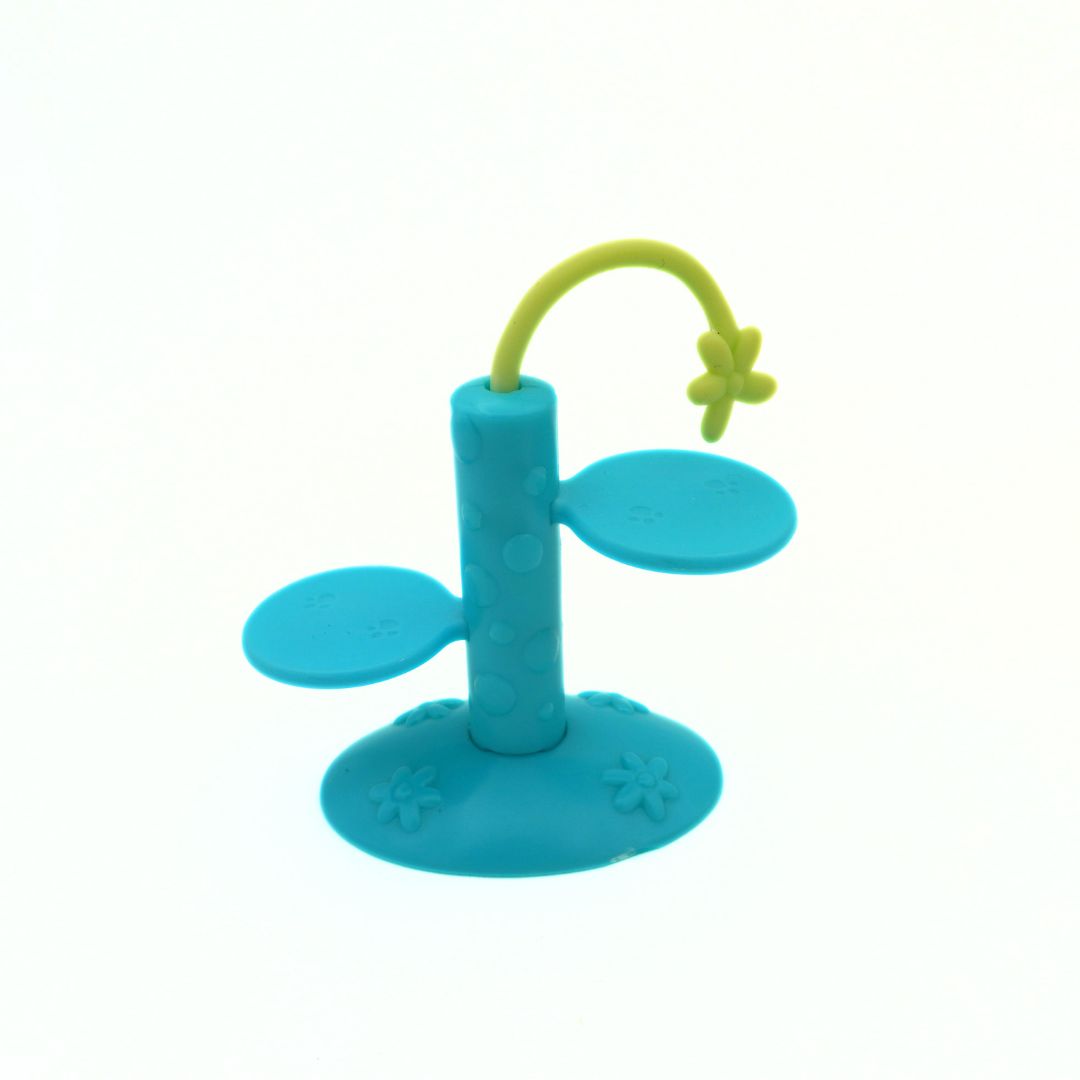 Blue and green pet toy on a white background