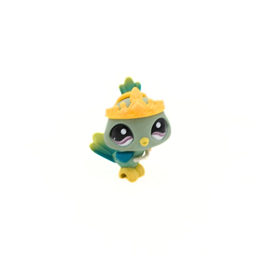 Toy figure of a green character with a yellow hat on a white background