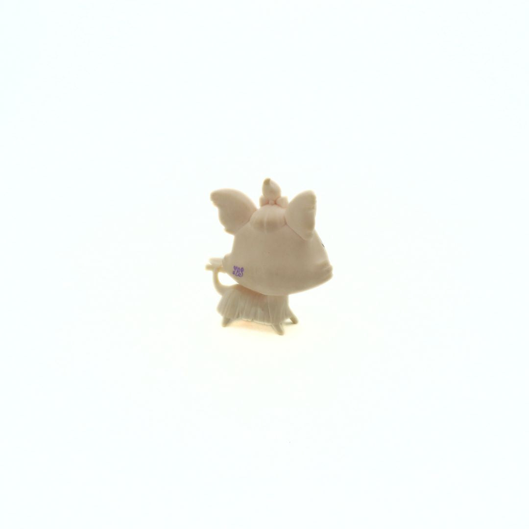 Small plastic toy of a light brown Yorkshire Terrier