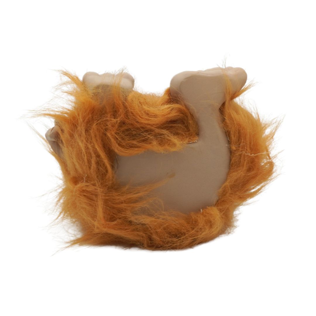 Toy with orange fur on a white background