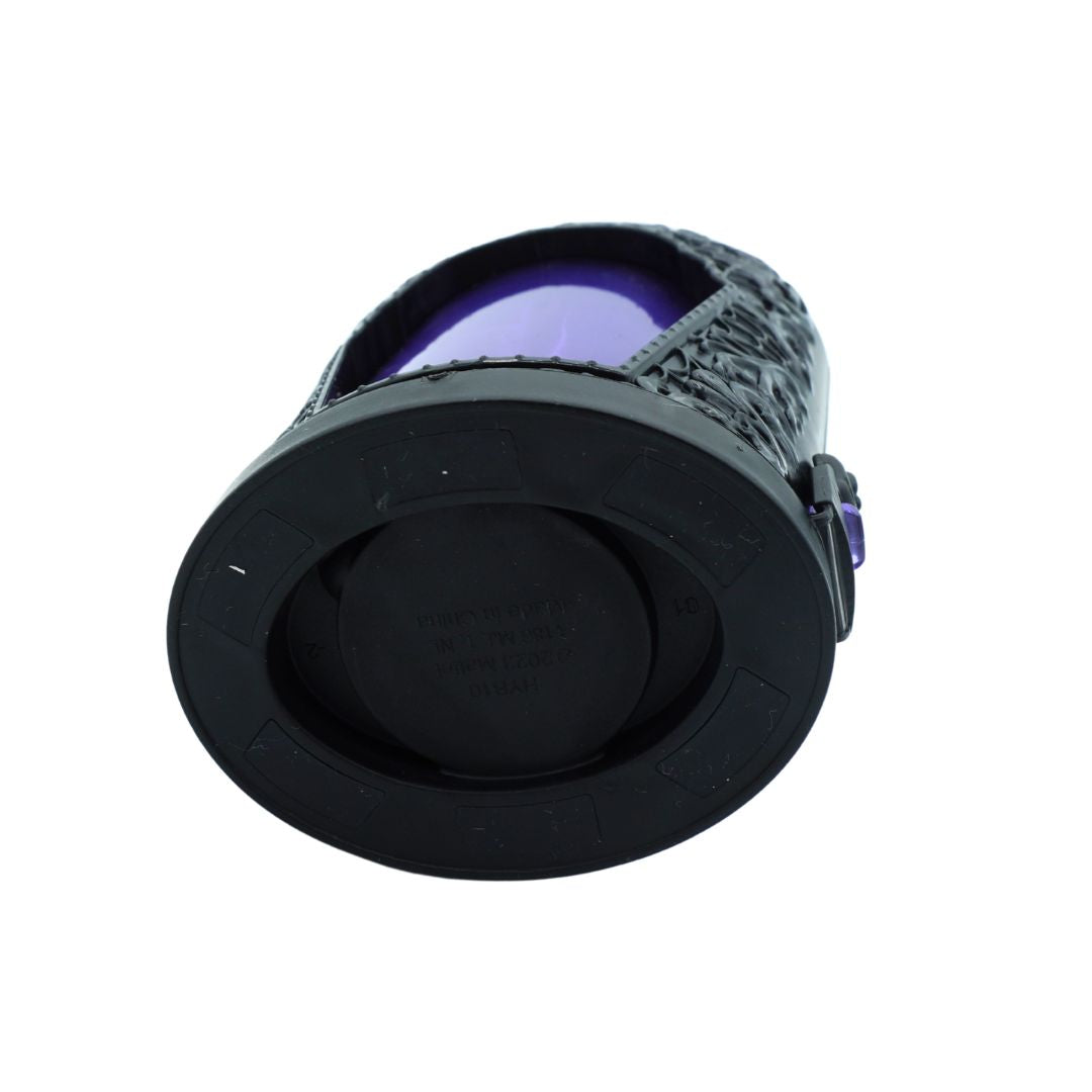 A black circular plastic component, likely a lens protector or cap for a camera lens, featuring a textured outer rim and a purple-tinted glass lens visible behind it, set against a plain white background.