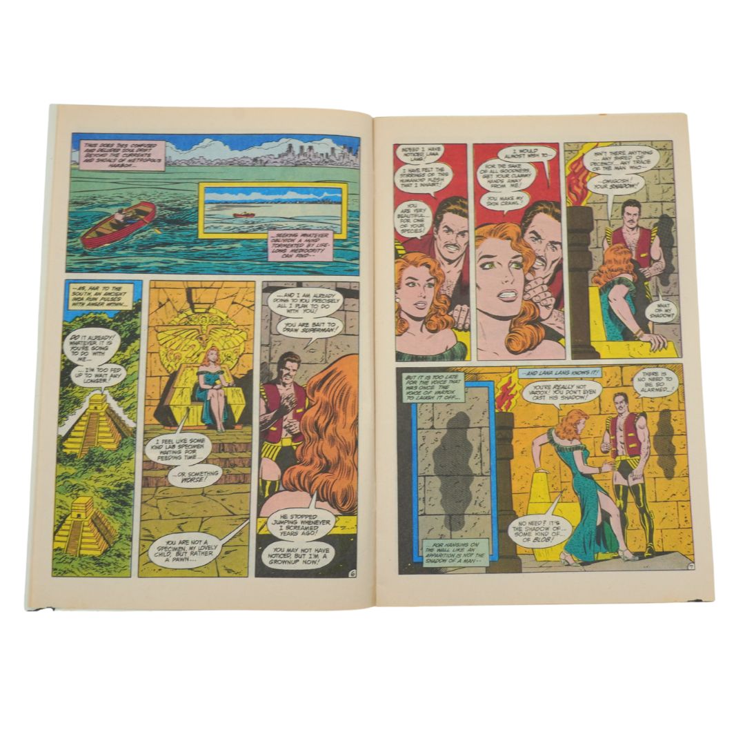 Open comic book with various panels on a white background