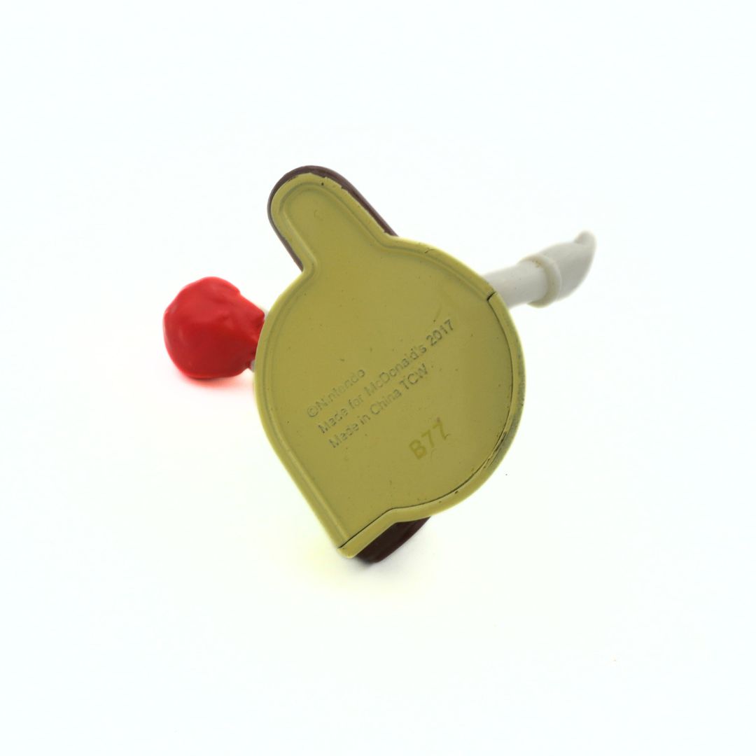 Underside of a 2017 McDonalds Luigi toy showing branding information