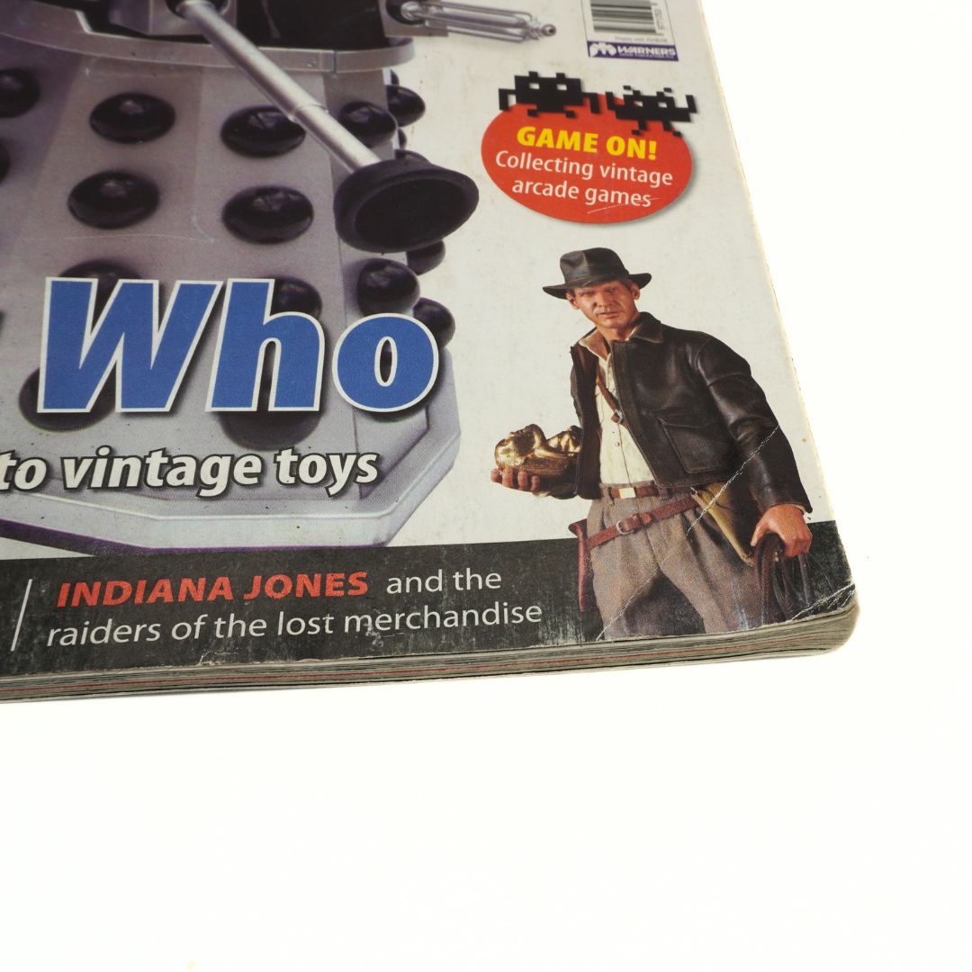 Creasing to the corner of a 2008 magazine on a graphic of Indiana Jones