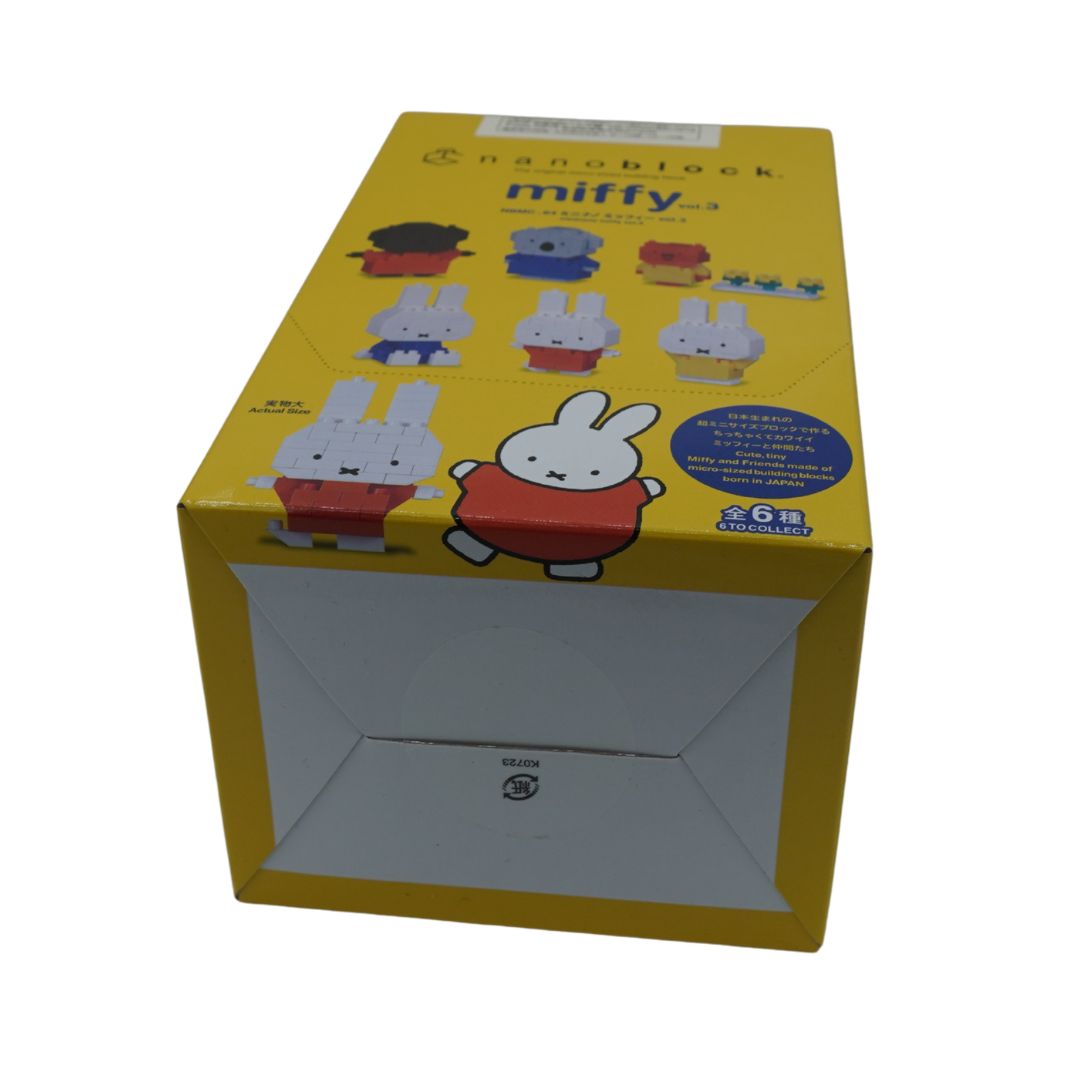 A yellow box of Miffy nanoblocks by nanoblock, featuring illustrations of the Miffy character and other toy figures on the front and top panels.