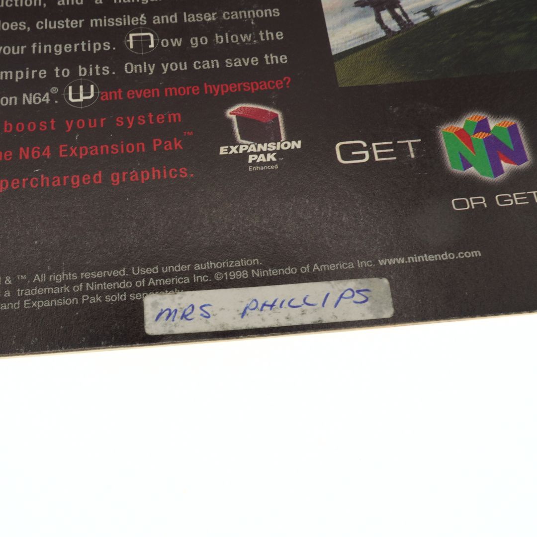 Close-up of a Nintendo N64 Expansion Pak label with branding and text.