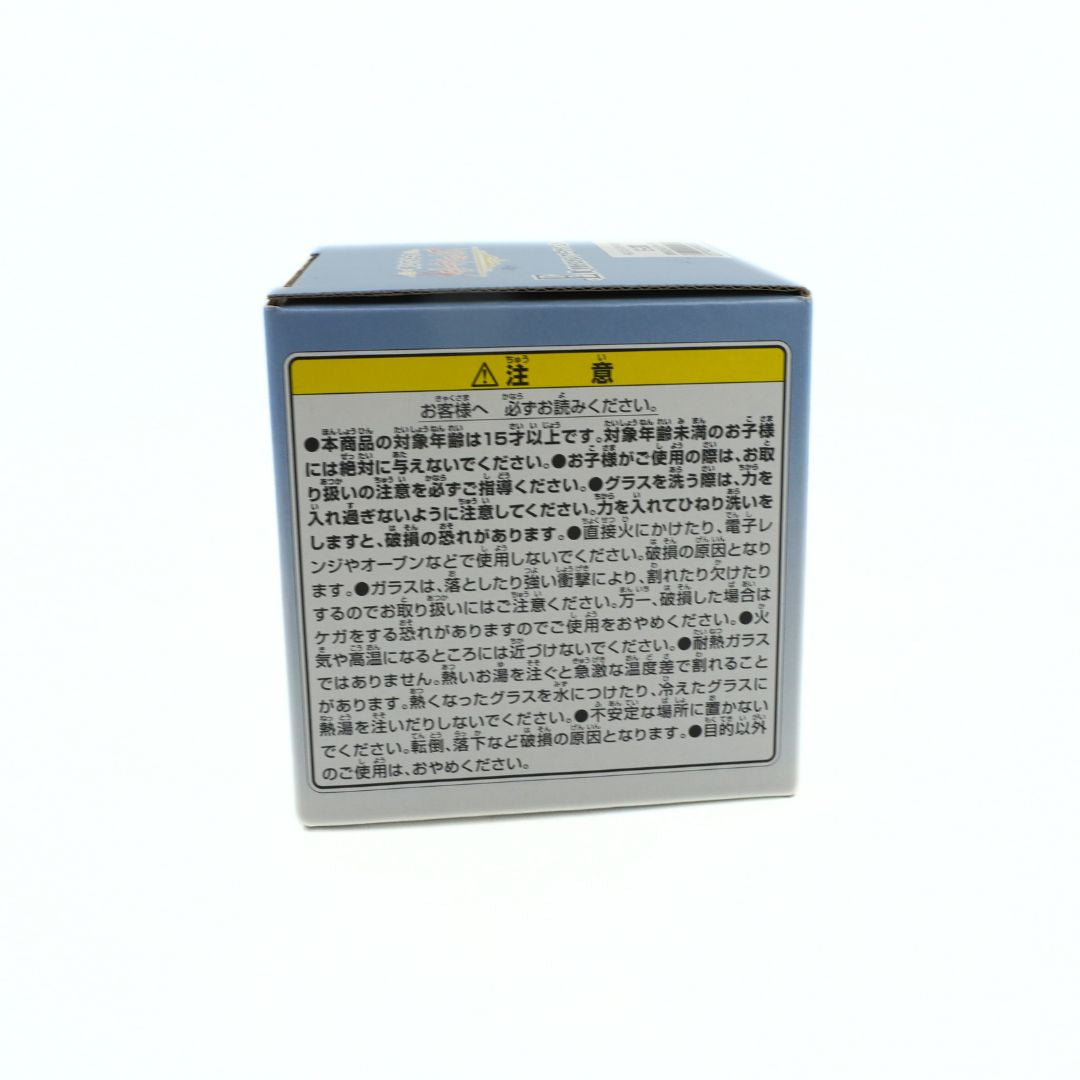 Side on photo of the box holding a Sugar One Piece glass featuring the hazard information