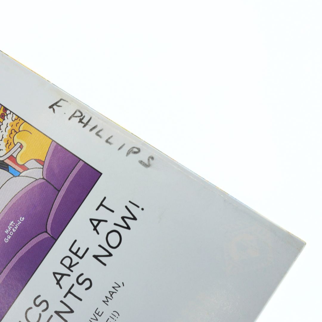 Book cover with text and a purple chair illustration on a white background