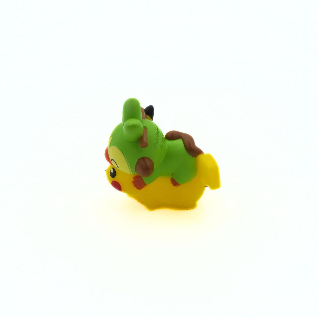 A hard plastic mini-figure of the Pokemon Pikachu and Grookey