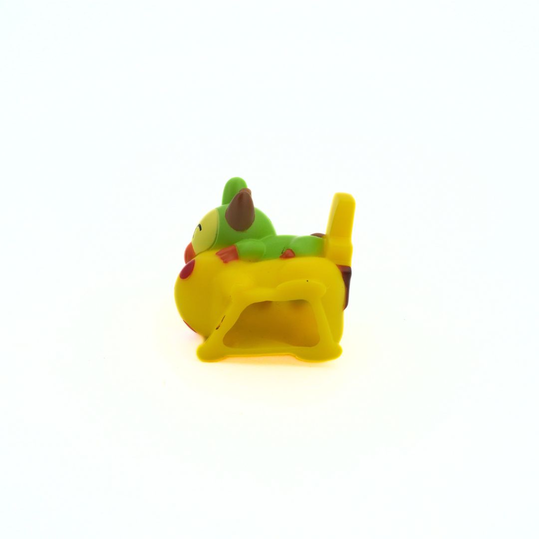 Underside of a hard plastic Pokemon figurine of Pikachu and Grookey