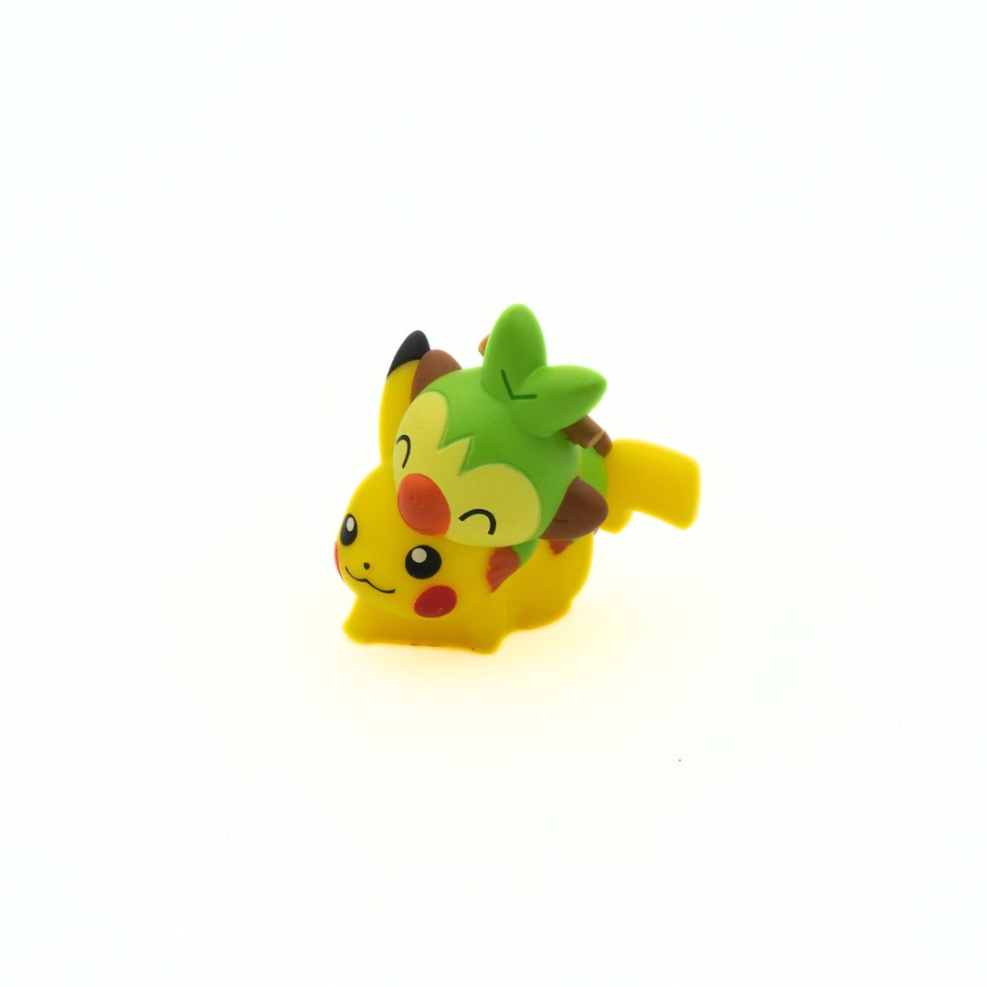 A hard plastic mini-figure of the Pokemon Pikachu and Grookey
