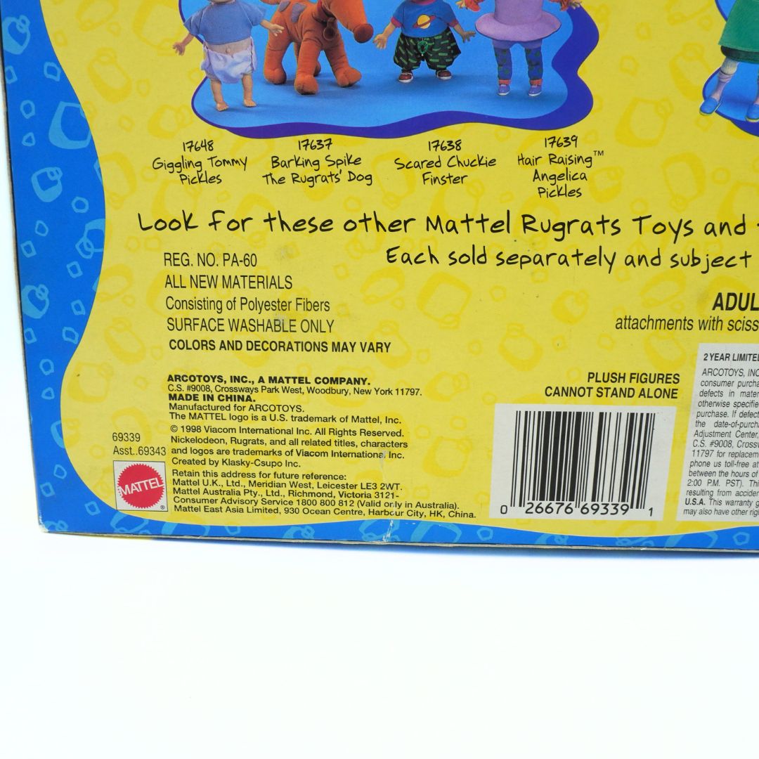 Back of a toy packaging with text and branding, featuring Mattel Rugrats characters.