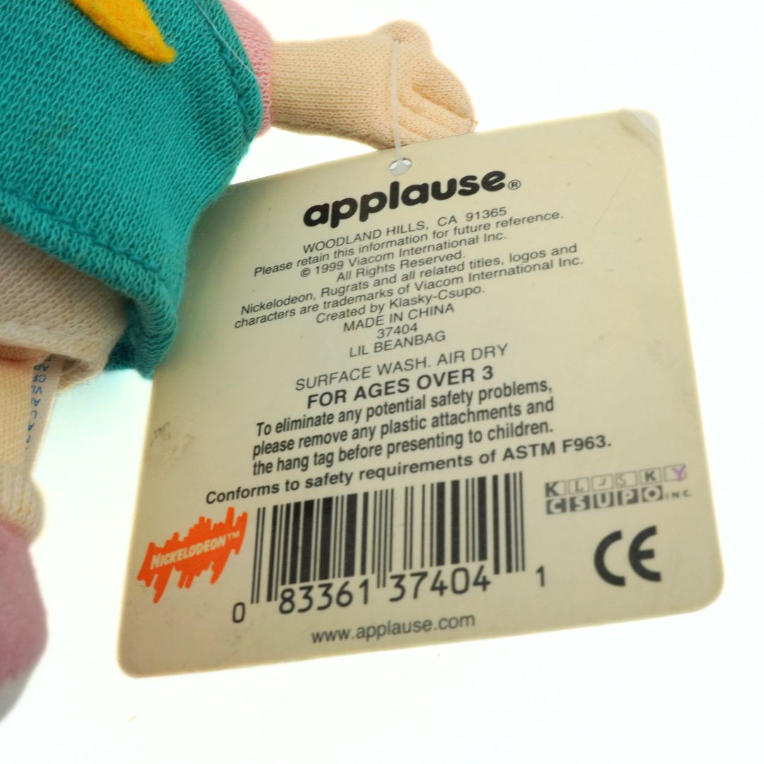 Copright and barcode information on the back of a tag on a Lil Deville Rugrats plush