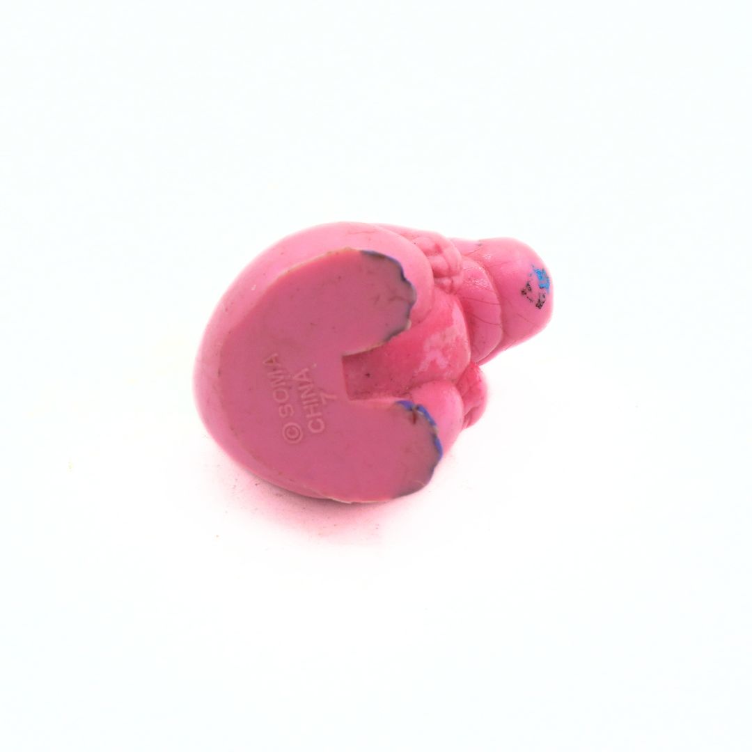 Pink dog toy with 'SOMA' branding on a white background