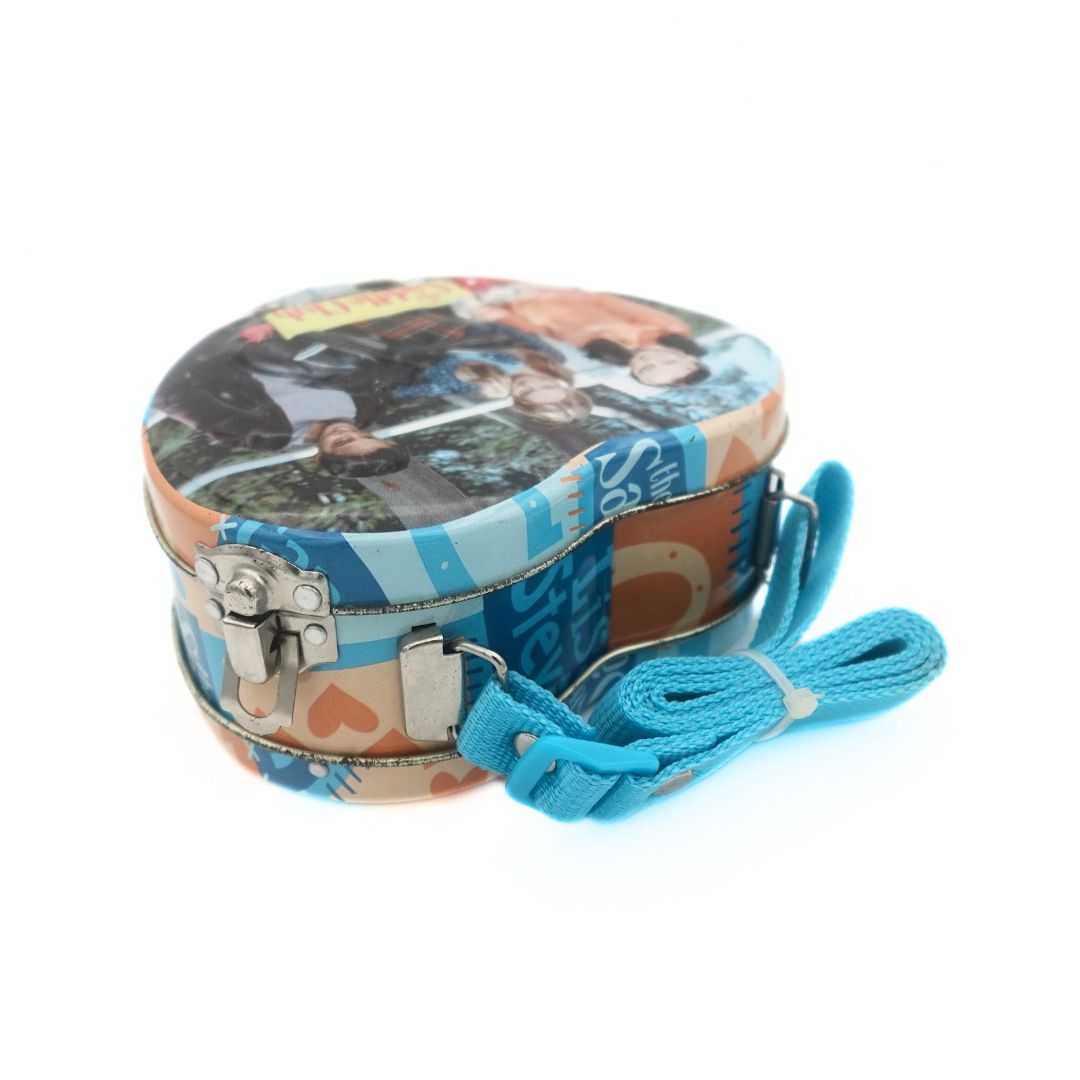 Blue and orange tin The Saddle Club bag with a woven strap