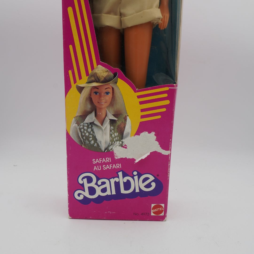 Barbie safari doll in packaging with pink and yellow design