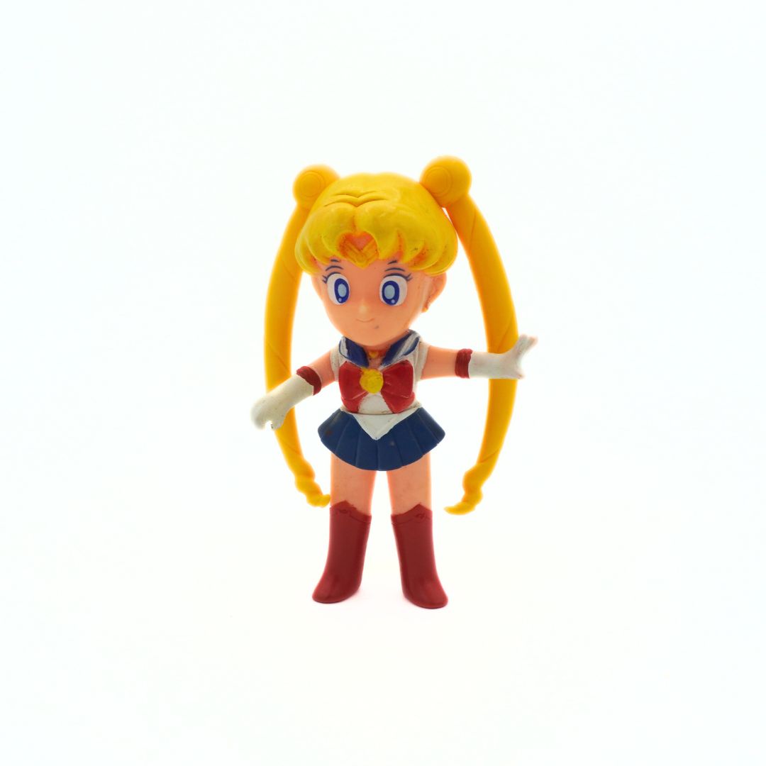 Photo of a vintage 1994 Bandai Sailor Moon figure with her arm outstretched
