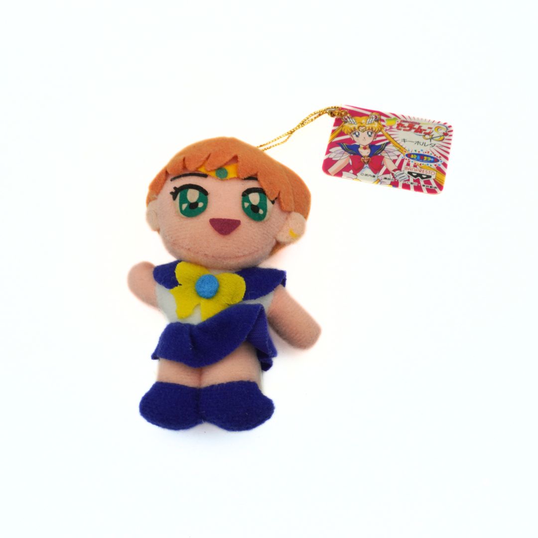 Mini Sailor Uranus plush wearing a blue uniform with tags still attached