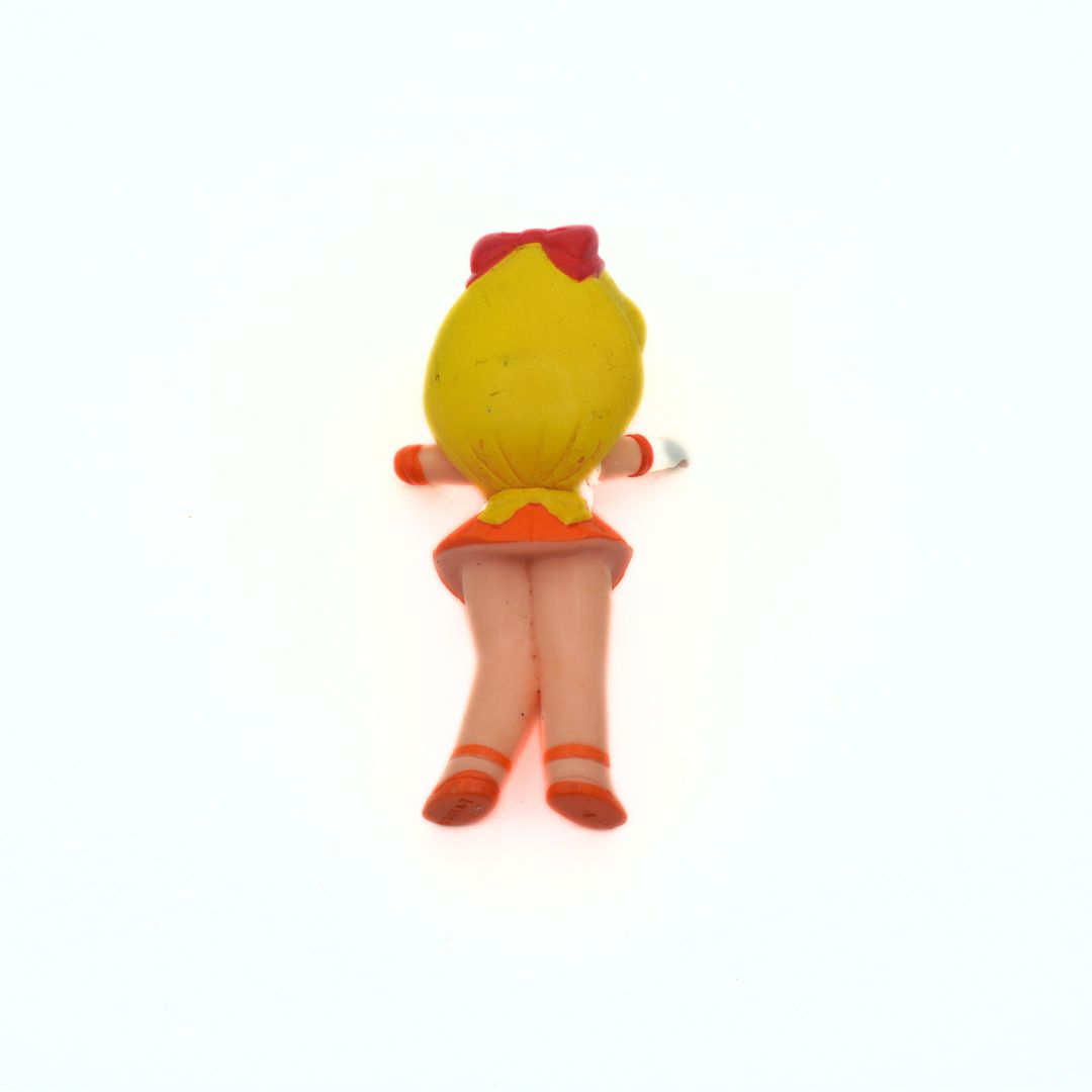 Photo of the back of a 1994 Bandai Sailor Venus figurine showing an orange skirt, red accessories and yellow hair