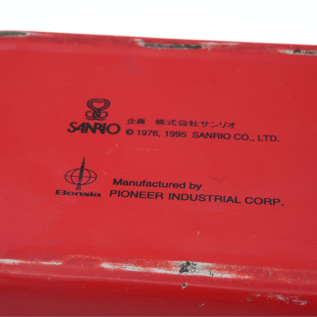 Red product with Sanrio branding and text on a white background