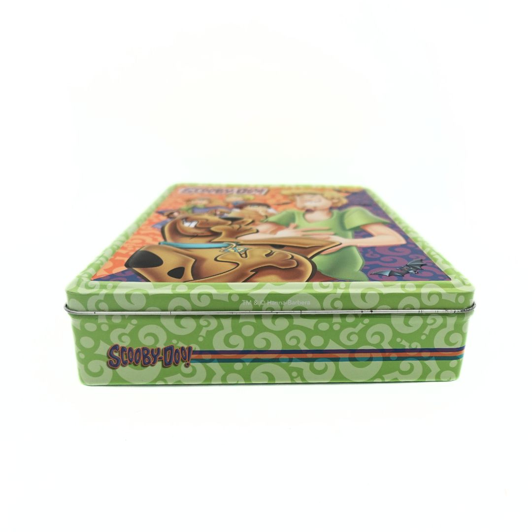 Photo of a green Scooby Doo tin with the branding and a green background