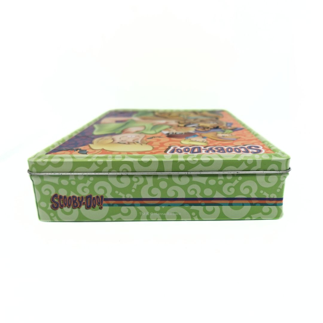 Top down photo of a vintage green Scooby-Doo tin