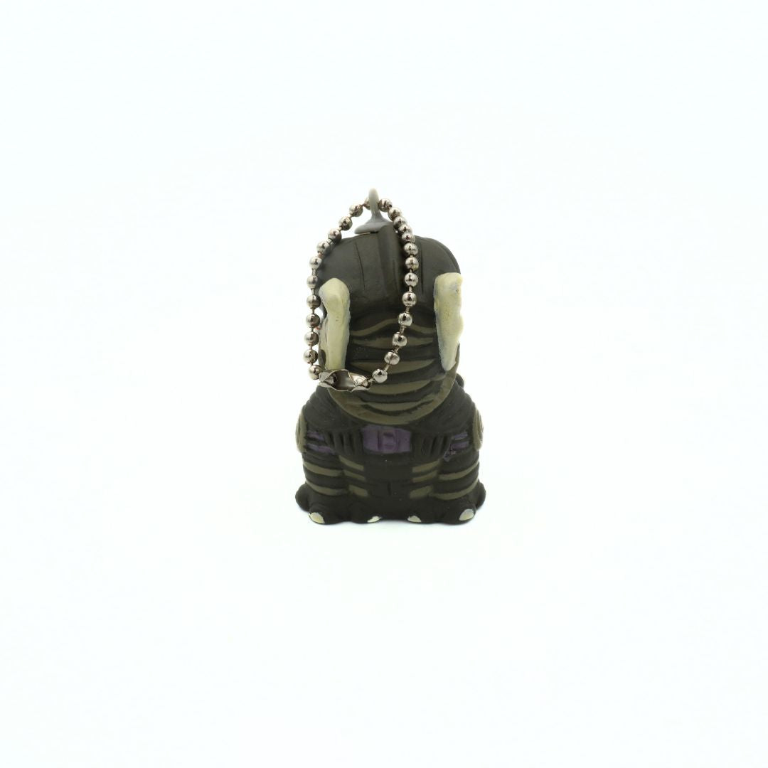 Back of a 90s Star Wars Phantom Menace Sebulba keychain, with him wearing his podracing outfit