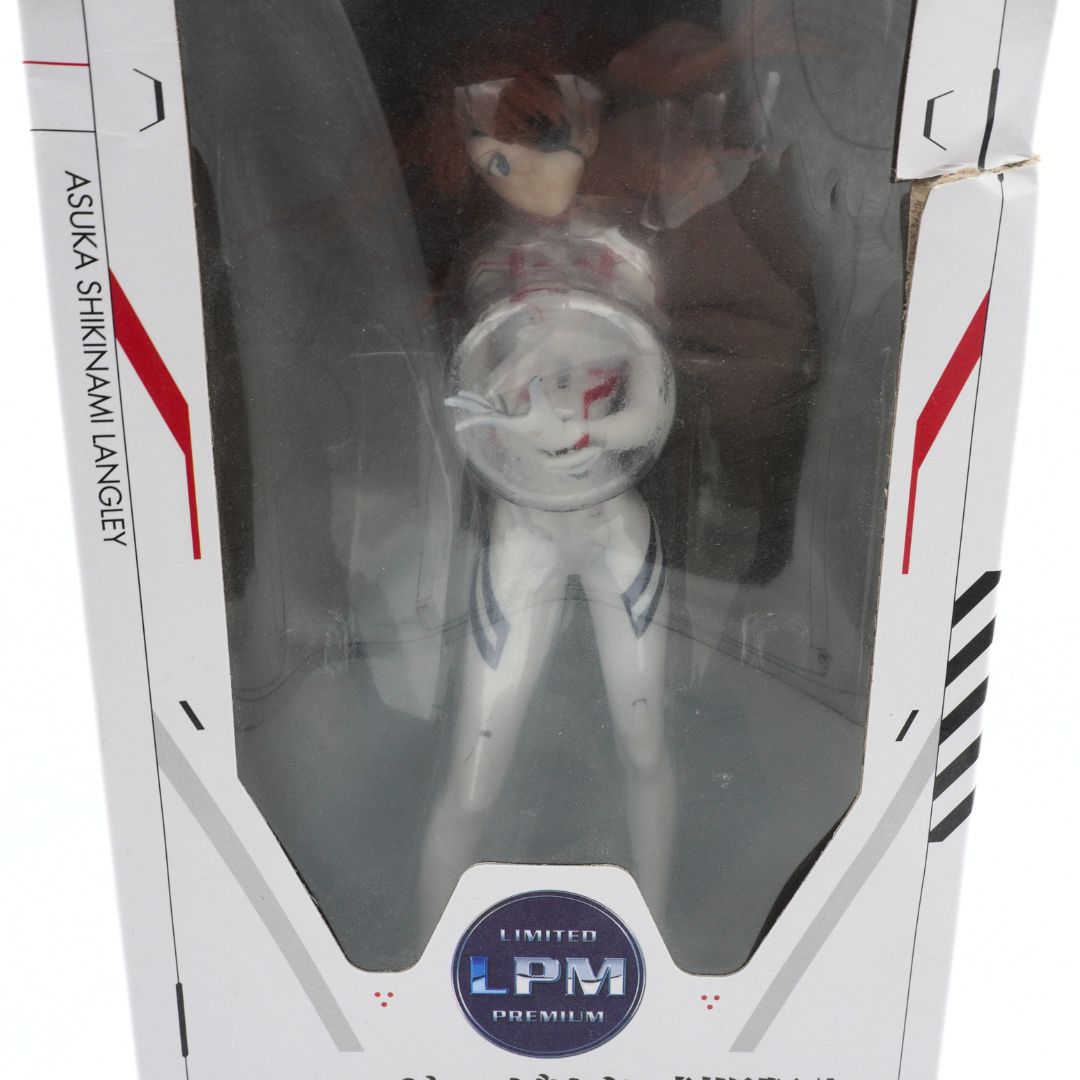Toy figure in a transparent box with branding and text