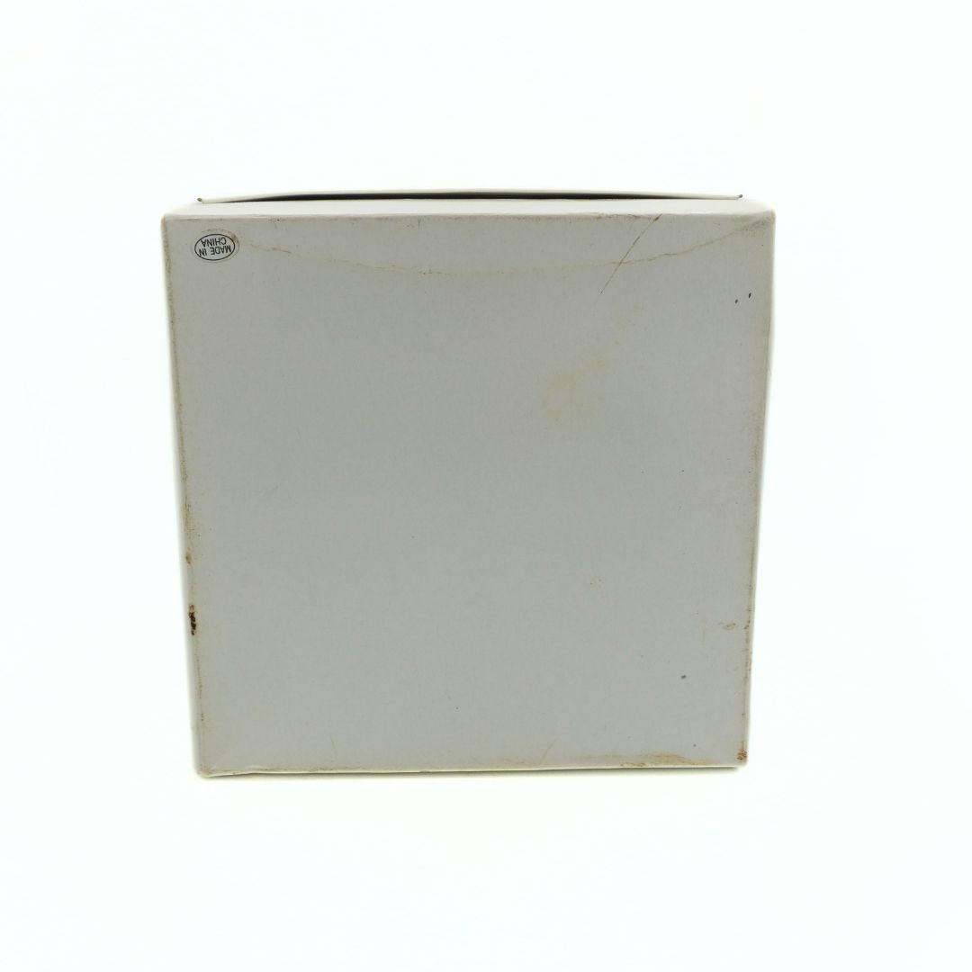 White rectangular box with a brand logo on a white background