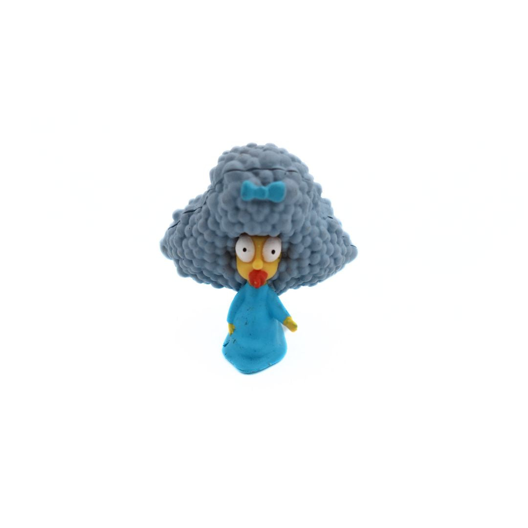 A 20th anniversary Simpsons Selma Patty Maggie figurine with a blue dress and bow