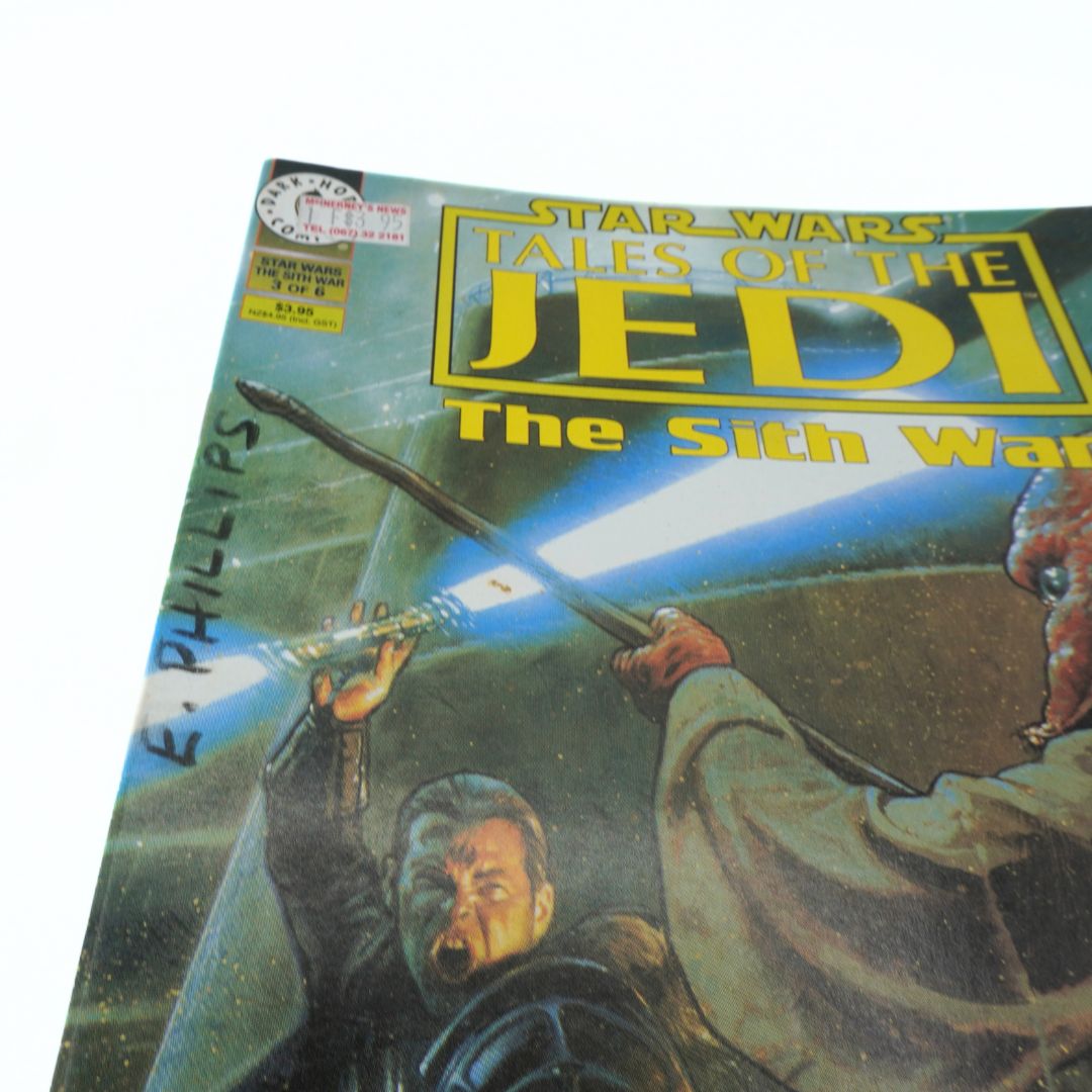 Comic book cover of 'Star Wars: Tales of the Jedi - The Sith War' with characters holding lightsabers.