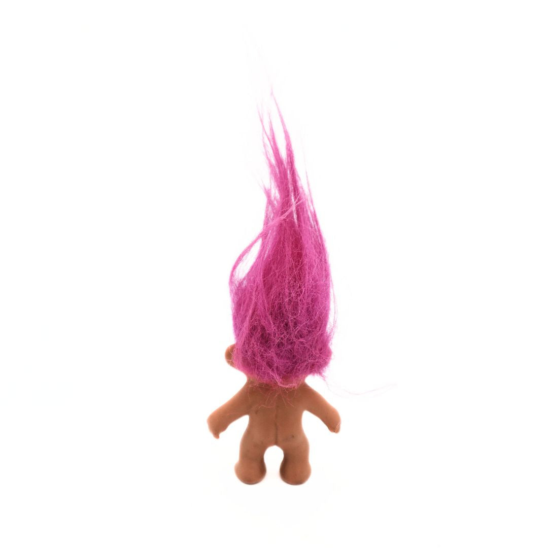 Back of a mini 90s era pink haired Troll Doll