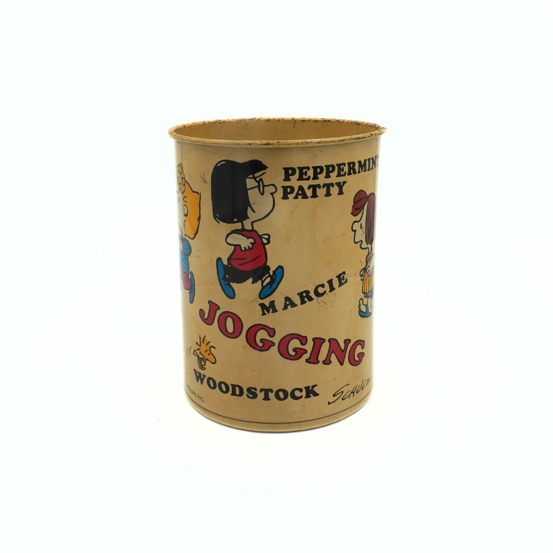 1971 Snoopy and Friends tin with multiple characters around the outside, visible here Peppermint Patty and Marcie