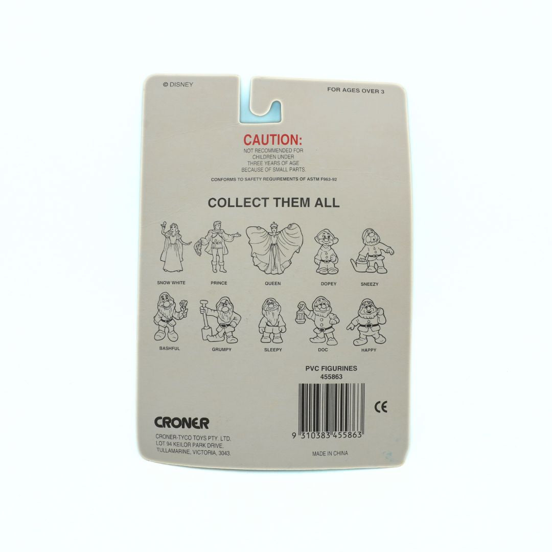 Back of a toy packaging with character illustrations and branding on a beige background