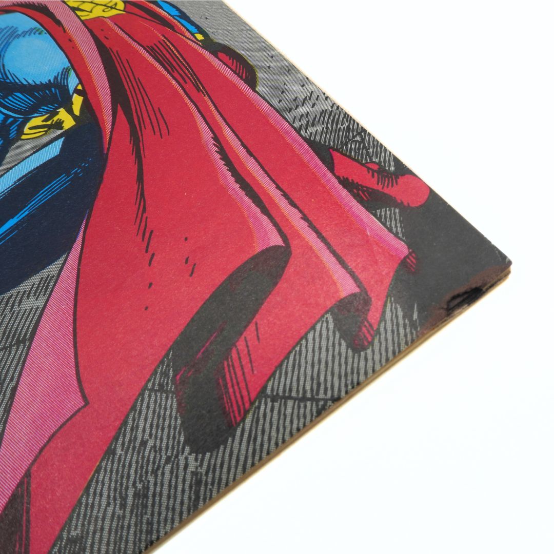 Close-up of a comic book-style illustration with a red cape and superhero design.